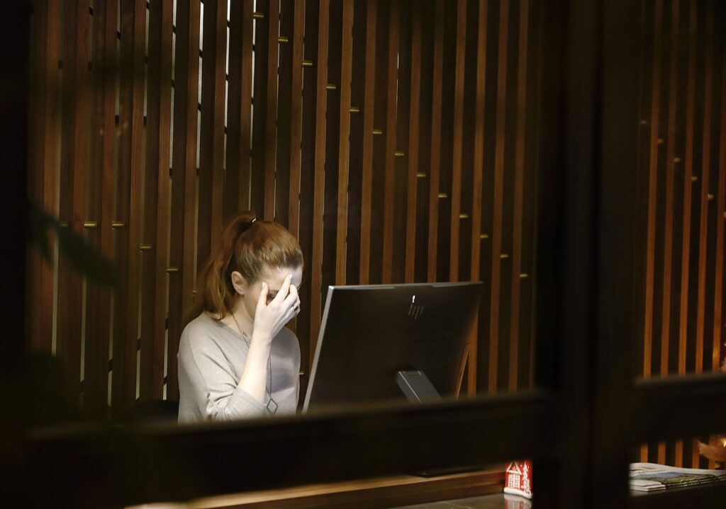 Photographer reviewing cost of doing business worksheet

